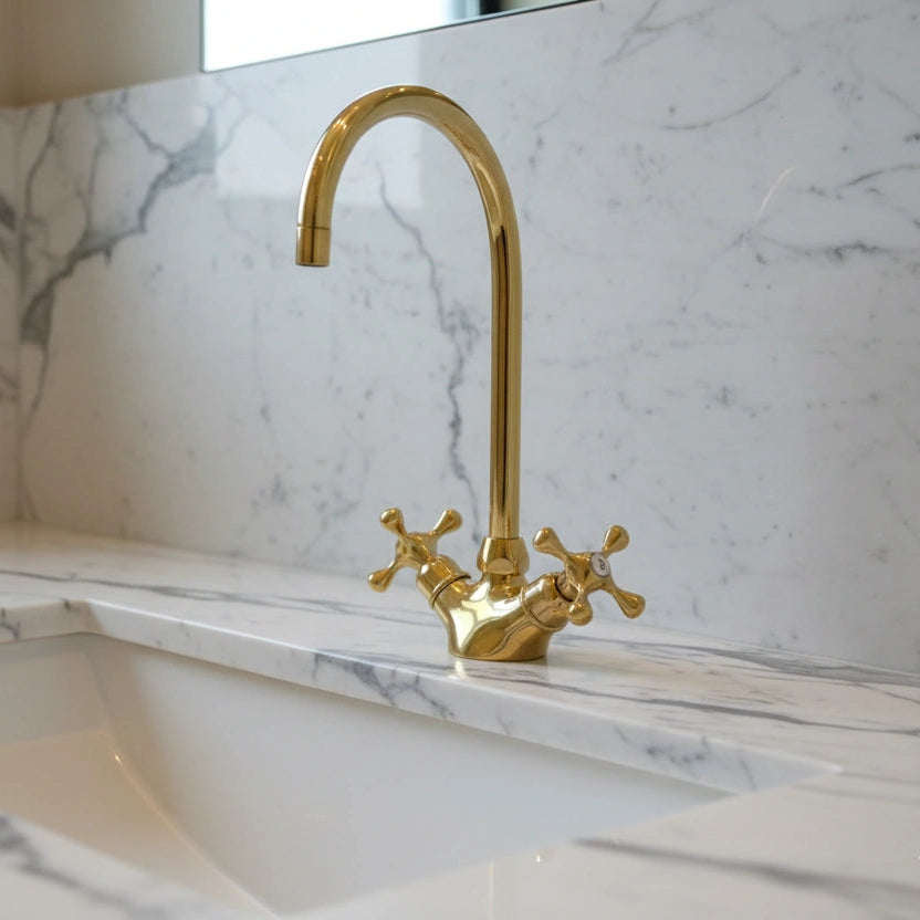 Gold faucet on a marble countertop
