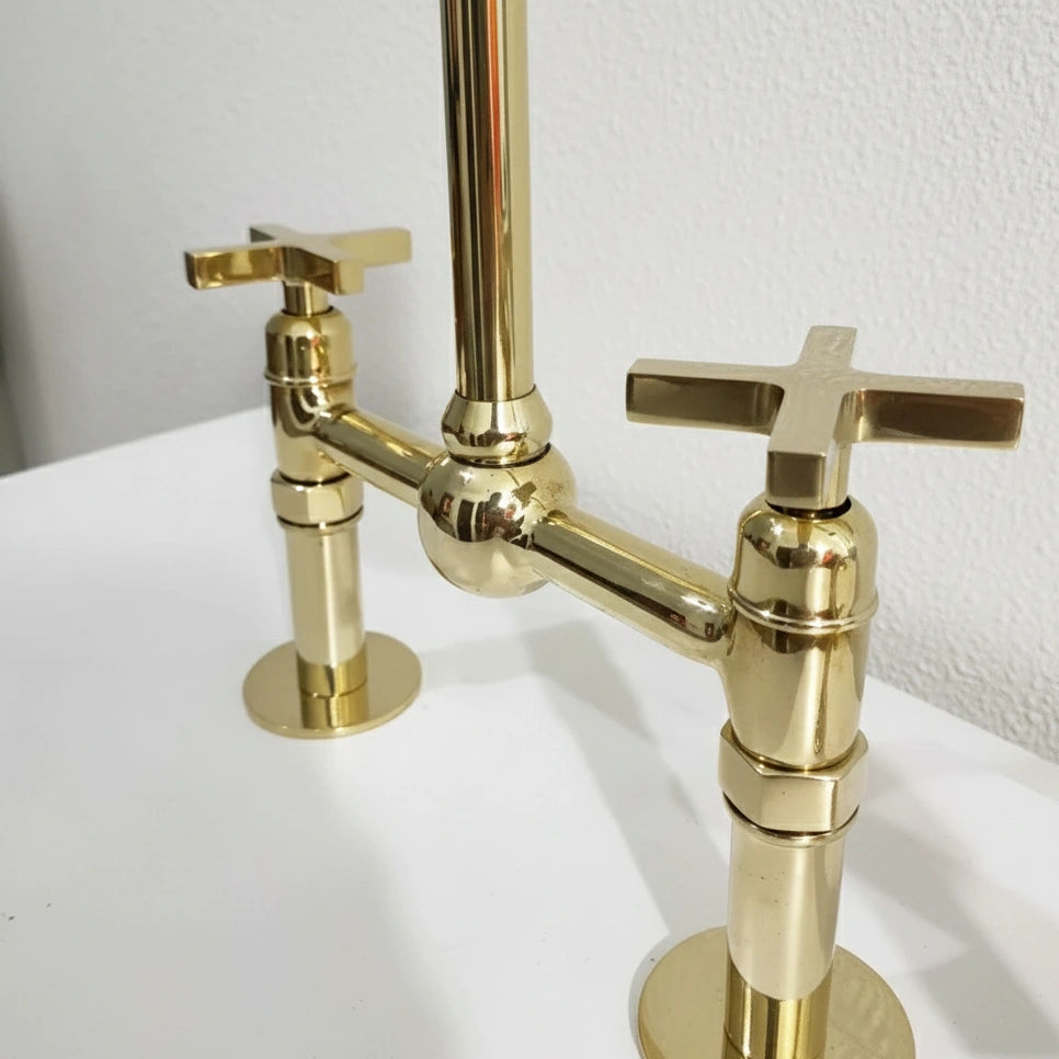 Gold faucet on a white background