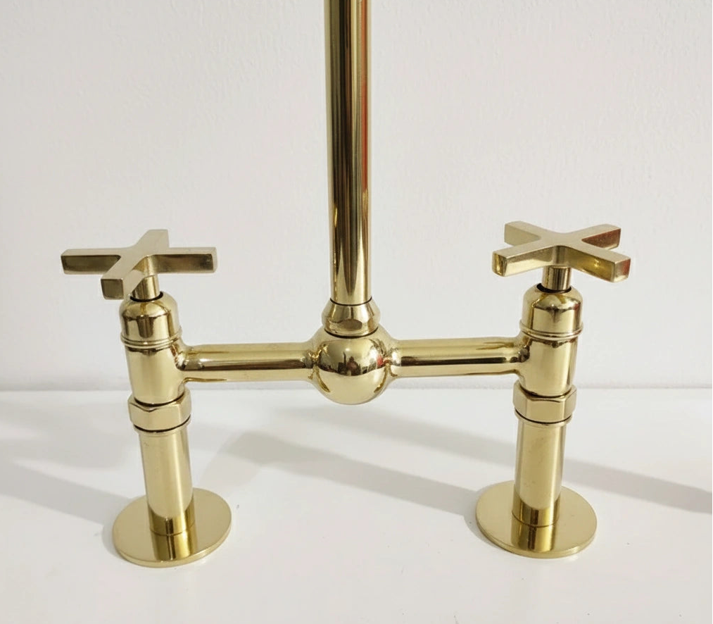 Gold faucet on a white background
